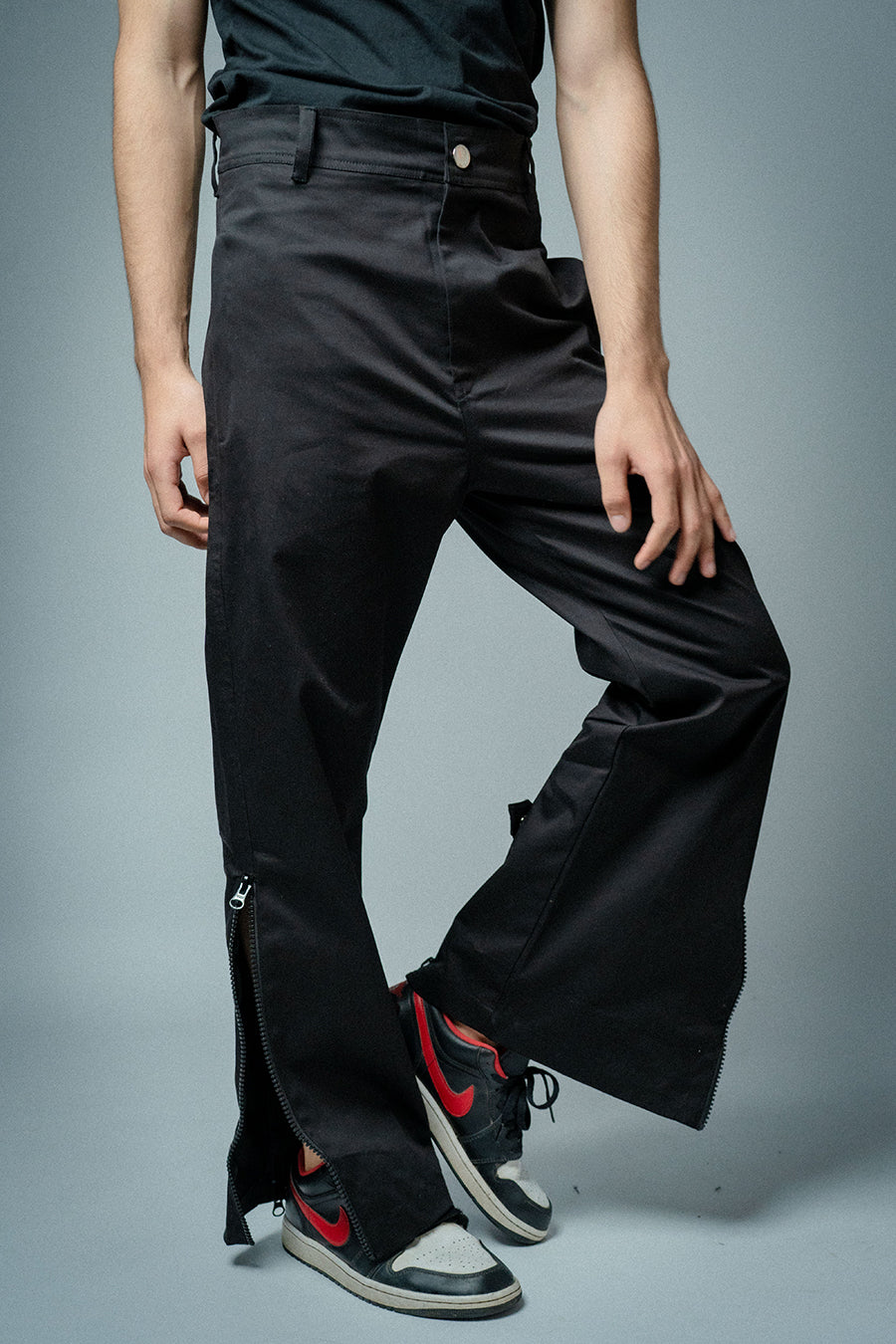 The epitome of urban chic and streetwear cool. With utility zips, leg-revealing zips, and back-flaring zips, these pants offer six reasons to love them, available at Cop Underdog In-store and ready to ship.